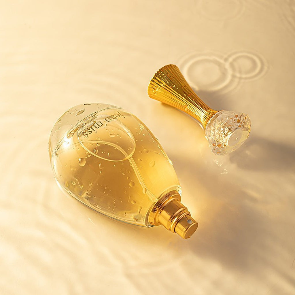 JEAN MISS True Me eau de parfum — bottle with crystal stopper and gold chiffon